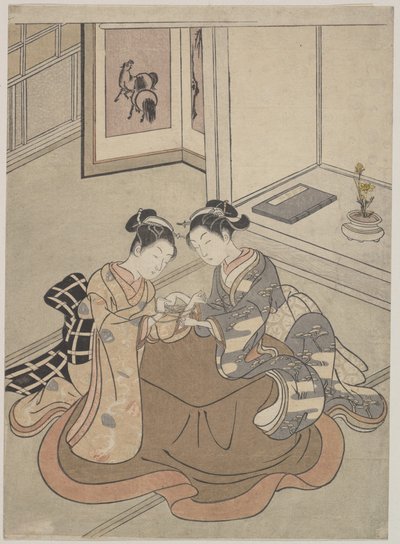 Two Young Women Seated by a Kotatsu Playing Cat